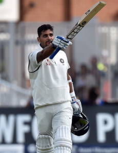 India's Murali Vijay celebrates after reaching his century during play on day 1 of the first cricket Test match between England and India at Trent Bridge in Nottingham, central England, on July 9, 2014. AFP PHOTO / PAUL ELLIS RESTRICTED TO EDITORIAL USE. NO ASSOCIATION WITH DIRECT COMPETITOR OF SPONSOR, PARTNER, OR SUPPLIER OF THE ECB        (Photo credit should read PAUL ELLIS/AFP/Getty Images)