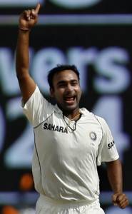 India's Amit Mishra celebrates after taking the wicket of England's Andrew Flintoff on the second day of their first test cricket match in Chennai December 12, 2008. REUTERS/Punit Paranjpe (INDIA)