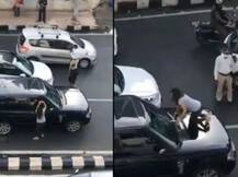 ਸੜਕ 'ਤੇ ਹੀ ਪਤਨੀ ਦਾ ਹੰਗਾਮਾ, ਪਤੀ ਦੀ ਕਾਰ 'ਤੇ ਚੜ੍ਹ ਕੀਤਾ ਇਹ ਕਾਰਾ