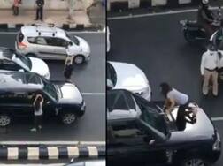 ਸੜਕ 'ਤੇ ਹੀ ਪਤਨੀ ਦਾ ਹੰਗਾਮਾ, ਪਤੀ ਦੀ ਕਾਰ 'ਤੇ ਚੜ੍ਹ ਕੀਤਾ ਇਹ ਕਾਰਾ