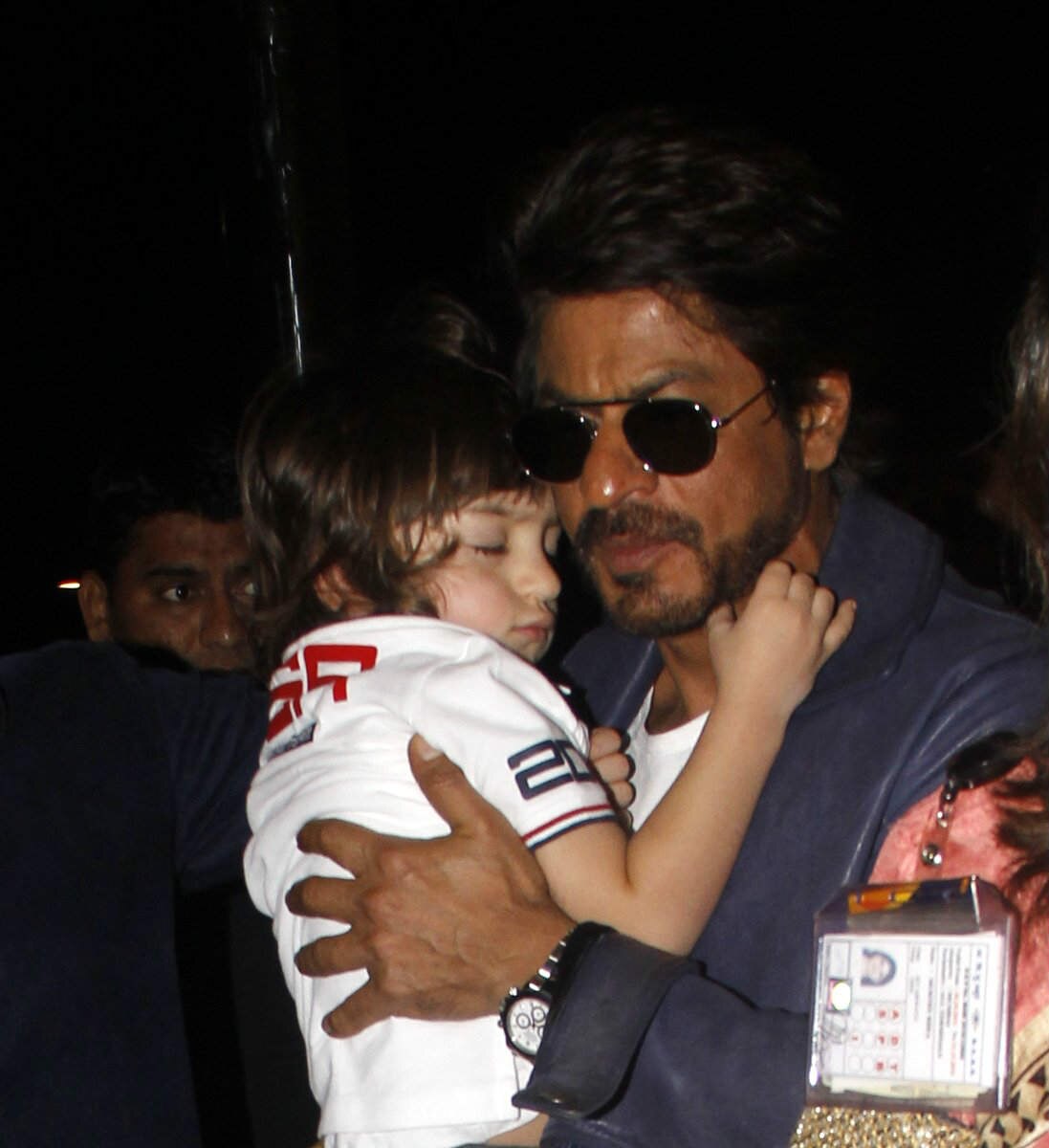 CHECK OUT: These PICS of AbRam SLEEPING in DADDY Shah Rukh Khan's arms at Airport will melt your hearts!