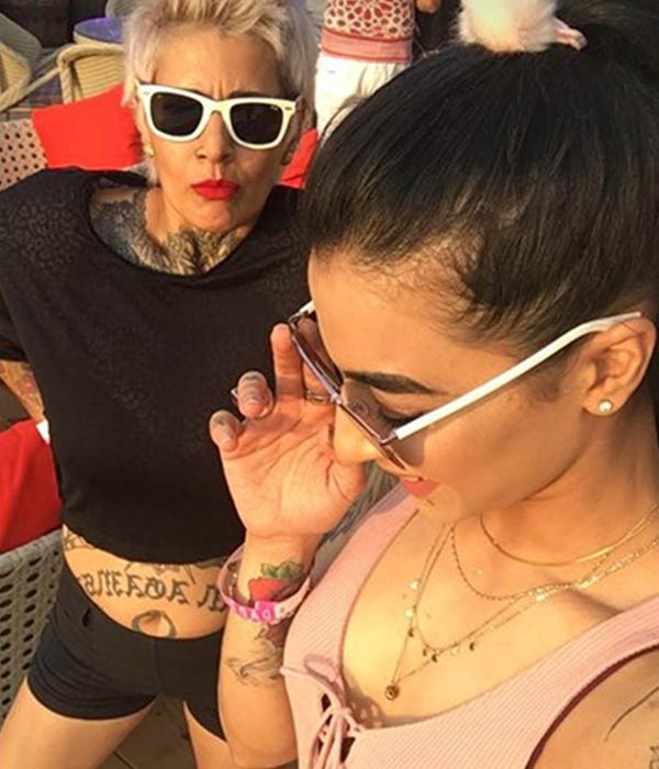 This pic of 'Bigg Boss' contestants Bani J & Sapna Bhavnani sharing a KISS in public is going VIRAL!