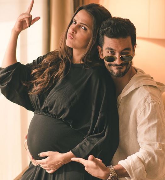 Neha Dhupia flaunts baby bump as she walks the ramp with hubby Angad Bedi at 'Lakme Fashion Week 2018'!