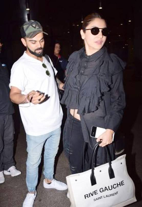 એરપોર્ટની બહાર નીકળતા વિરાટ અને અનુષ્કા