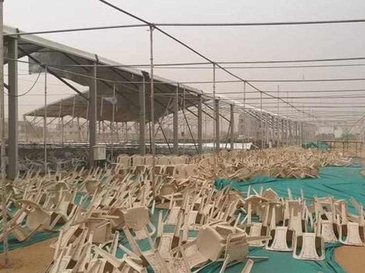 Dust storm damages part of tent for Narendra Modi's Gujarat rally  ભારે પવનને કારણે PM મોદીની સભાનો આખે આખો મંડપ અને ખુરશીઓ હવામાં ઉડી, જુઓ આ રહી તસવીરો