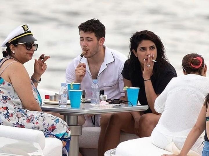 Actress Priyanka Chopra smokes with his mother on yacht in Miami પ્રિંયકા ચોપડાની સિગારેટ પીતી તસવીર વાયરલ થતાં શું થયા પ્રિયંકાના હાલ? જાણીને ચોંકી જશો
