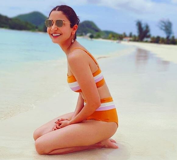 Anushka Sharma shares pic in bikini from West Indies અનુષ્કા શર્માએ બિકિનીમાં શેર કરી તસવીર, કોહલીએ કરી આવી કોમેન્ટ, જાણો વિગત